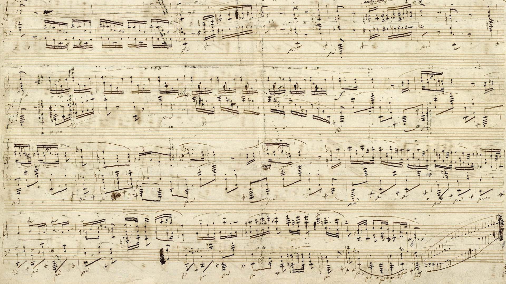 Handwritten music notation as background